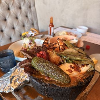 Besame Mucho - Molcajete in the foreground With aguachiles and calamari in the back - Breakfast & Brunch Near Me - Santa Rosa, California Besame Mucho - Molcajete in the foreground With aguachiles and calamari in the back - Breakfast & Brunch Near Me - Santa Rosa, California