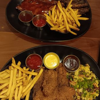 Tap 42 - Kendall - Half rack ribs with chicken wings and chicken tenders with Asian slaw. - New American Near Me - Miami, Florida Tap 42 - Kendall - Half rack ribs with chicken wings and chicken tenders with Asian slaw. - New American Near Me - Miami, Florida