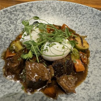 Finch & Fork - Braised Beef with Brussels sprouts and carrots and pouched eggs. - New American Near Me - Santa Barbara, California Finch & Fork - Braised Beef with Brussels sprouts and carrots and pouched eggs. - New American Near Me - Santa Barbara, California