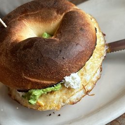 Bagel sandwich with egg and avocado and cream cheese Bagel sandwich with egg and avocado and cream cheese