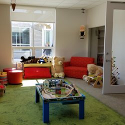Door County Library - Egg Harbor - The children's room includes toys, comfortable furniture, and a train table.