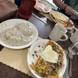 Miners Cafe - Biscuits and gravy and loaded hash browns with an egg