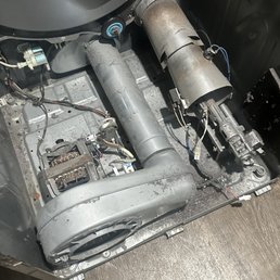 Inside the dryer and he showed me the broken part.