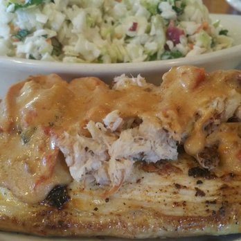 O. C. White's Restaurant - Mahi, with a sauce and crab meat on top. Coleslaw, I mean, chopped cabbage in background. - Seafood Near Me - St Augustine, Florida