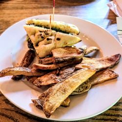 The StoneHouse - Steak and Focaccia (Steak with Arugula, Pesto, Roasted Roma Tomatoes & Fresh Mozzarella) with Steak Fries at The Stonehouse