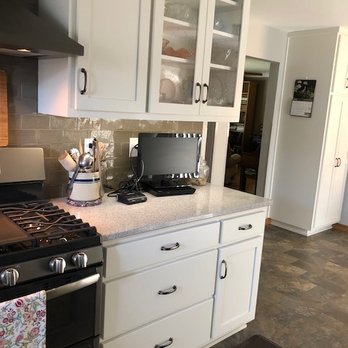 Rick Halvorson Construction - a kitchen with white cabinets and black appliances - General Contractors Near Me - Moorhead, Minnesota Rick Halvorson Construction - a kitchen with white cabinets and black appliances - General Contractors Near Me - Moorhead, Minnesota