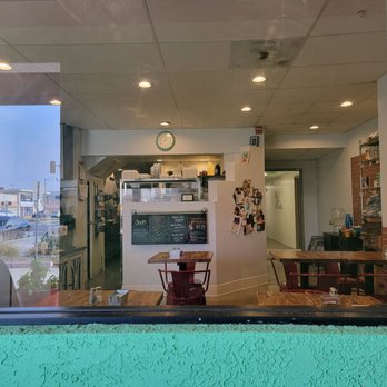Sacks in the City - a view of a restaurant through a window - Cafes Near Me - Redondo Beach, California Sacks in the City - a view of a restaurant through a window - Cafes Near Me - Redondo Beach, California