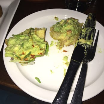 Neme Gastro Bar - Tostones with avocado -split in half - Gastropubs Near Me - Miami, Florida Neme Gastro Bar - Tostones with avocado -split in half - Gastropubs Near Me - Miami, Florida