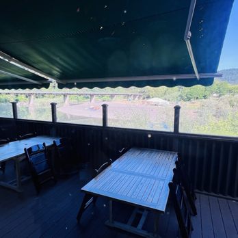 Highland Dell - Outdoor seating with view of Russian River - Hotels Near Me - Monte Rio, California