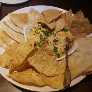 Yard House - Artichoke and crab dip with chips and pita bread. - New American Near Me - Austin, Texas Yard House - Artichoke and crab dip with chips and pita bread. - New American Near Me - Austin, Texas