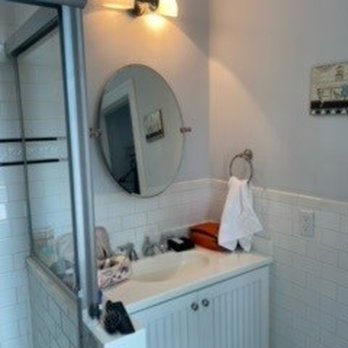 The Chalfonte Hotel - Only light and mirror in bathroom for a king size room. - Hotels Near Me - Cape May, New Jersey The Chalfonte Hotel - Only light and mirror in bathroom for a king size room. - Hotels Near Me - Cape May, New Jersey
