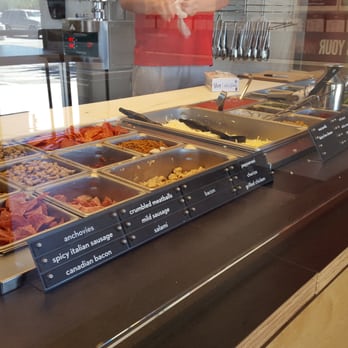 MOD Pizza - Foreground to background: meats, sauces, greens - Pizza Near Me - Morgan Hill, California