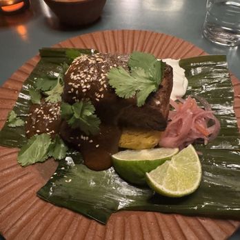 Casa Susanna - Tamal Tonto (heirloom yellow corn), Pork Belly, Fermented Mole Negro, Crema, Pickled Habanero Red Onions - Mexican Near Me - Leeds, New York Casa Susanna - Tamal Tonto (heirloom yellow corn), Pork Belly, Fermented Mole Negro, Crema, Pickled Habanero Red Onions - Mexican Near Me - Leeds, New York