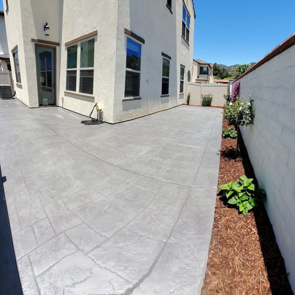 F G Landscape Construction - a concrete patio with a fence - Landscaping Near Me F G Landscape Construction - a concrete patio with a fence - Landscaping Near Me