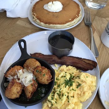 Magnolia Table - Lemon blueberry pancake, eggs and bacon, and breakfast tator tots. - Breakfast & Brunch Near Me - Waco, Texas Magnolia Table - Lemon blueberry pancake, eggs and bacon, and breakfast tator tots. - Breakfast & Brunch Near Me - Waco, Texas