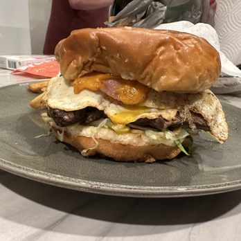 Pa’que Roberto - Tenderloin steak sandwich with a fried egg, ham,tiny fries, sauce, cheese and fresh toasted bun. - Venezuelan Near Me - Madison, Wisconsin