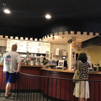 Pita Delite - a man and a woman standing at a counter - Lebanese Near Me - Greensboro, North Carolina