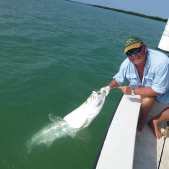 Key West Fly Fishing - Angler Jon Sigmond of Norway brings a 90 pound Tarpon to Capt. Dexter's boat after a 60 minute fight. - Fishing Near Me - Summerland Key, Florida Key West Fly Fishing - Angler Jon Sigmond of Norway brings a 90 pound Tarpon to Capt. Dexter's boat after a 60 minute fight. - Fishing Near Me - Summerland Key, Florida