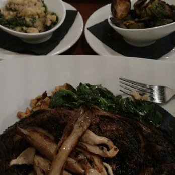 56 Kitchen - Solon - Ribeye steak with oyster mushrooms sauteed kale and polenta. Brussel sprouts and branzino in a wonderful sauce - New American Near Me - Solon, Ohio 56 Kitchen - Solon - Ribeye steak with oyster mushrooms sauteed kale and polenta. Brussel sprouts and branzino in a wonderful sauce - New American Near Me - Solon, Ohio