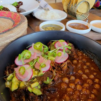 Anepalco - dry Lamb with fresh made tortillas.  Salsa flight in the back (must request it) - Mexican Near Me - Orange, California