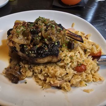 River & Post - Pork Chops w/ Sautéed Onions and Bacon Side of rice - Lounges Near Me - Jacksonville, Florida