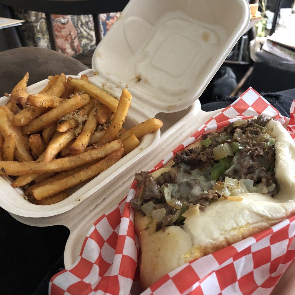 Philly Ya Belly - Garlic Fries and a Philly Cheesesteak (with peppers and onions). Not pictured: grilled jalapeños - Chicken Wings Near Me - Kirkland, Washington Philly Ya Belly - Garlic Fries and a Philly Cheesesteak (with peppers and onions). Not pictured: grilled jalapeños - Chicken Wings Near Me - Kirkland, Washington