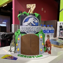 a dinosaur themed cake a dinosaur themed cake
