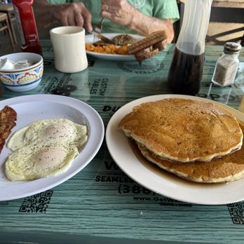 Beacon Restaurant - Crispy bacon and eggs, 3 large pancakes. - Breakfast & Brunch Near Me - New Smyrna Beach, Florida Beacon Restaurant - Crispy bacon and eggs, 3 large pancakes. - Breakfast & Brunch Near Me - New Smyrna Beach, Florida