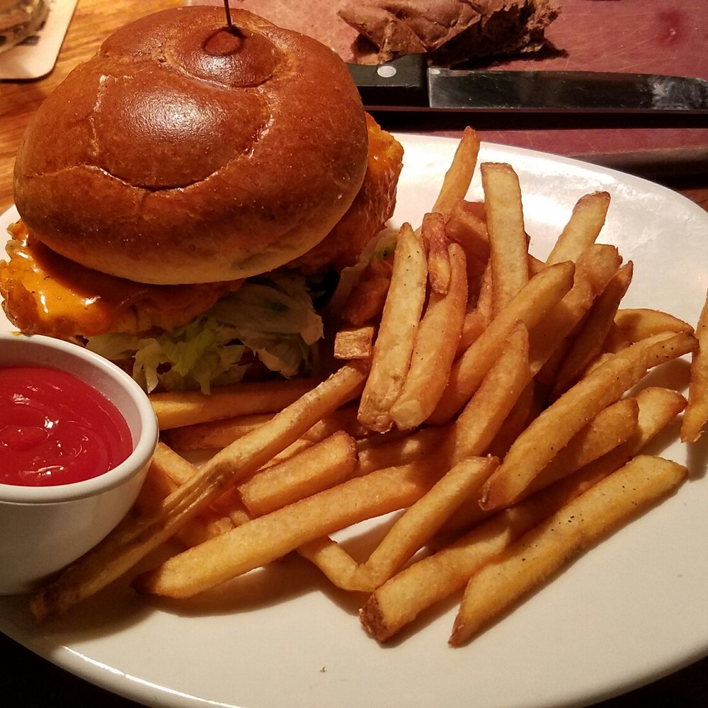 Outback Steakhouse - Crispy Buffalo Chicken sammach with fries.  Very nice presentation. - Steakhouses Near Me - Middletown, New York