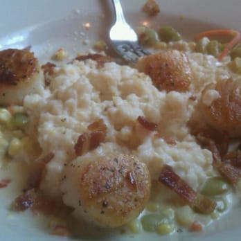 The Kill Devil Grill - Savory local scallops with grits and local corn sucotash - American Near Me - Kill Devil Hills, North Carolina