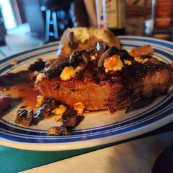 Olde Suffolk Ale House - Horseradish and blue cheese encrusted New York Strip, baked potato, and seasoned carrots.