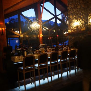 Cirque - a bar with chairs and a chandelier - Bars Near Me - Fernie, British Columbia