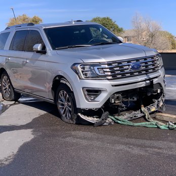 Cobblestone Auto Spa - The damage caused by cobblestone after they had to call in a crane to lift the car off the wall. - Car Wash Near Me - Gilbert, Arizona Cobblestone Auto Spa - The damage caused by cobblestone after they had to call in a crane to lift the car off the wall. - Car Wash Near Me - Gilbert, Arizona