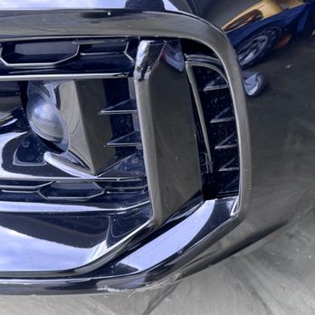 In Stock Auto Collision - Another view of the dislodged trim piece. - Body Shops Near Me - Orlando, Florida In Stock Auto Collision - Another view of the dislodged trim piece. - Body Shops Near Me - Orlando, Florida