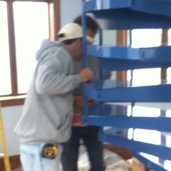 Sweeney Construction - two men working on a spiral staircase - General Contractors Near Me - East Bridgewater, Massachusetts Sweeney Construction - two men working on a spiral staircase - General Contractors Near Me - East Bridgewater, Massachusetts