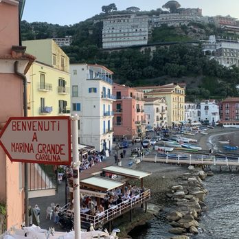 Porta Marina - Fishermen village where restaurant is. Location is between yellow and white building. - Italian Near Me - Sorrento, NA
