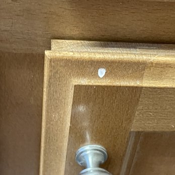 Rodin Painting - Baseboard paint on laundry room cabinet - Painters Near Me