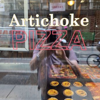 Artichoke Basille’s Pizza - Window reflection - Pizza Near Me - New York, New York Artichoke Basille’s Pizza - Window reflection - Pizza Near Me - New York, New York