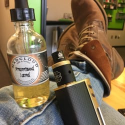 NiceCloud Vapor - One of the owners taking a vape break, Sigelei 213, dottmod Petri RDA, and the amazing Promised Land juice.
