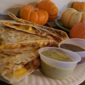 Quesadilla Gorilla - The Outlaw. A daily special with grilled onions, seasoned ground beef, cheddar cheese, crispy bacon and homemade BBQ sauce. - Mexican Near Me - Visalia, California Quesadilla Gorilla - The Outlaw. A daily special with grilled onions, seasoned ground beef, cheddar cheese, crispy bacon and homemade BBQ sauce. - Mexican Near Me - Visalia, California