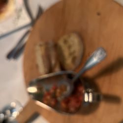 Di Valle's Cucina Italiana & Wine Bar - Mostly eaten and blurry photo of the toasted bread and bruschetta topping homemade & complimentary! Delish!