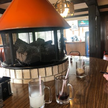 Pete's Drive In - a table with drinks and a fireplace - Fast Food Near Me - Wentzville, Missouri Pete's Drive In - a table with drinks and a fireplace - Fast Food Near Me - Wentzville, Missouri