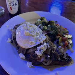Three Sheets Bar & Grill - Steak topped with egg, onions, mushrooms and blue cheese. Side of veggies