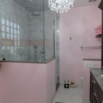 Mahogany Builders - a pink bathroom with a chandelier - General Contractors Near Me - Chicago, Illinois