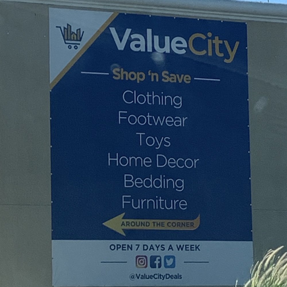 Bundle City Outlet - Building signage on corner leading to store - Discount Store Near Me - Highland, California