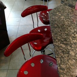 Wine red tractor barstool from Desks Galore Wine red tractor barstool from Desks Galore