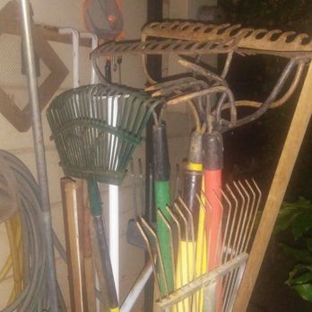 Awesome Landscaping - Old- fashioned tools in hand. - Landscaping Near Me