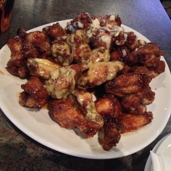 Woody's On Brunette - Blue cheese, Thai chili, honey mustard, and honey garlic wings~ - Pubs Near Me - Coquitlam, British Columbia Woody's On Brunette - Blue cheese, Thai chili, honey mustard, and honey garlic wings~ - Pubs Near Me - Coquitlam, British Columbia