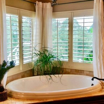 Oklahoma Shutters - Master Bath 3.5 Louver Plantation Shutter. Center tilt, two panel shutter. Corner window set with garden tub. - Shutters Near Me - Tulsa, Oklahoma Oklahoma Shutters - Master Bath 3.5 Louver Plantation Shutter. Center tilt, two panel shutter. Corner window set with garden tub. - Shutters Near Me - Tulsa, Oklahoma