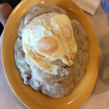 Squeeze In - Two biscuits and gravy with two eggs on top - American Near Me - Las Vegas, Nevada Squeeze In - Two biscuits and gravy with two eggs on top - American Near Me - Las Vegas, Nevada